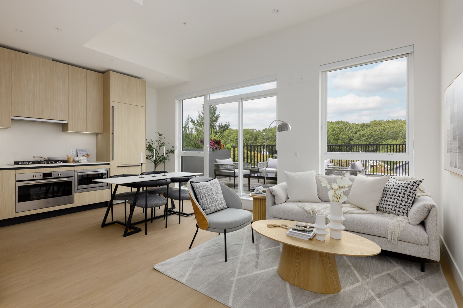 Open living and dining space with balcony views